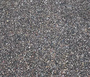 Close-up textured finish of decorative exposed aggregate concrete